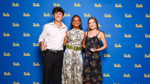 2025-26 Scholar-Athletes of the Year Shawn Toney and Annika Salz with Director of Track & Field/Cross Country Joanna Hayes