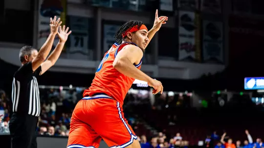 Julian Bowie celebrates after making a 3-pointer against Washington on Oct. 17 at Idaho Central Arena.