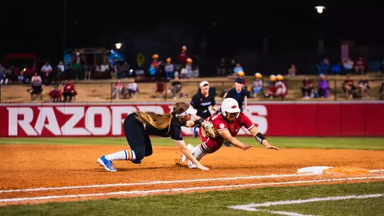 Kate Penberthy tags out a runner at Arkansas to complete an unassisted double play, Feb. 27, 2026.