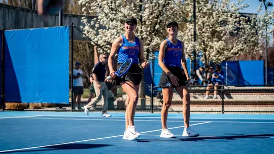 Zdena Safarova and Tereza Polakova laughing after clinching a match