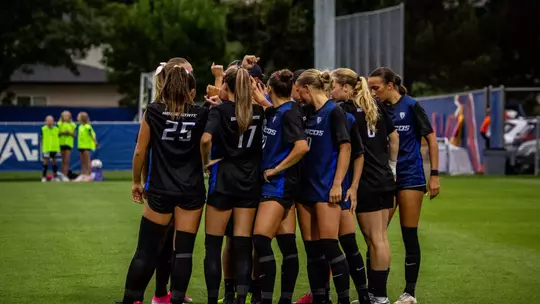 Boise State soccer team huddle.