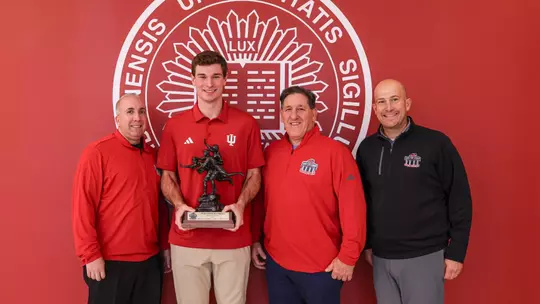 BLOOMINGTON, IN - December 10, 2025 - quarterback Fernando Mendoza #15 of the Indiana Hoosiers and staff of Walter Camp Foundation during the Walter Camp Player of the Year Presentation at Memorial Stadium in Bloomington, IN. Photo By Dani Meersman/Indiana Athletics