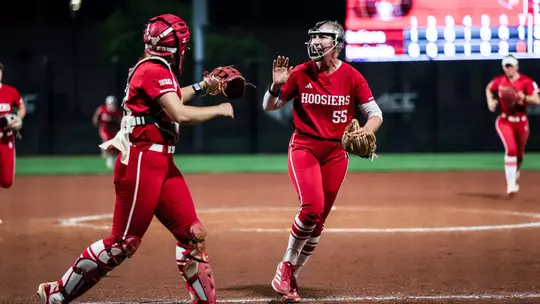 BLOOMINGTON, IN - April 15, 2026 - catcher\utility Avery Parker #18 of the Indiana Hoosiers and pitcher Taylor Hess #55 of the Indiana Hoosiers during the game between the Louisville Cardinals and the Indiana Hoosiers at Don Dobina Field at Ulmer Stadium. Photo By Emma Pearce/Indiana Athletics
