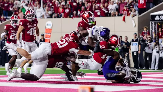 BLOOMINGTON, IN - September 25, 2026 - linebacker Jacob Savage #21 of the Indiana Hoosiers and line backer Rolijah Hardy #5 of the Indiana Hoosiers and defensive lineman Tyrique Tucker #95 of the Indiana Hoosiers and defensive lineman Daniel Ndukwe #17 of the Indiana Hoosiers during the game between the Northwestern Wildcats and the Indiana Hoosiers at Merchants Bank Field at Memorial Stadium in Bloomington, IN. Photo By Luke Miller/Indiana Athletics