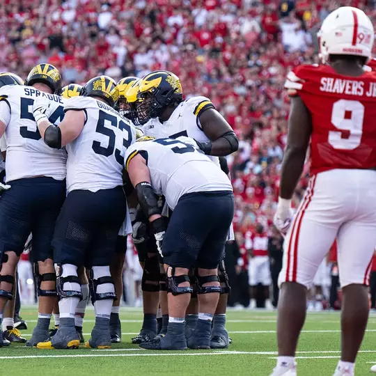 Michigan offensive line team huddle
