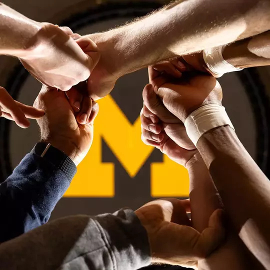 Men's Basketball Team Huddle