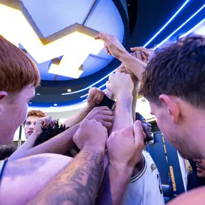 Men's Basketball Team Huddle