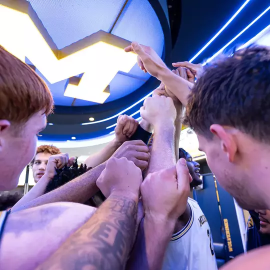 Men's Basketball Team Huddle
