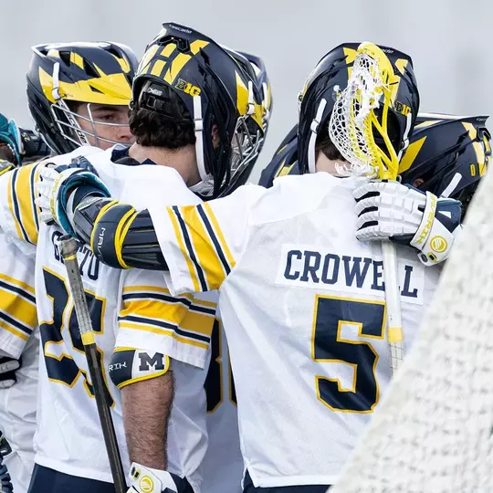 Men's lacrosse team huddle