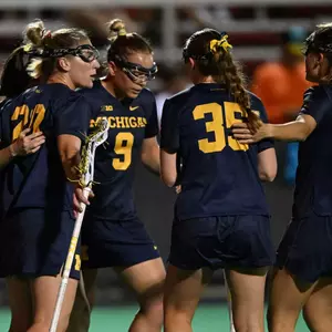 Michigan Women's Lacrosse huddle - Big Ten Championships