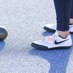Track and Field Shot Put and Shoes