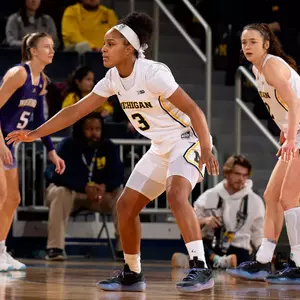 Mila Holloway, center, and Syla Swords, right