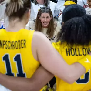 Head coach Kim Barnes Arico gathers the Michigan women's basketball team for a huddle ahead of their Big Ten Tournament clash with No. 12 seed Washington at Gainbridge Fieldhouse in Indianapolis, Ind. on March 6.