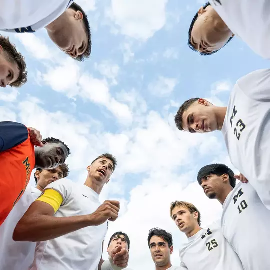 Men's soccer team huddle
