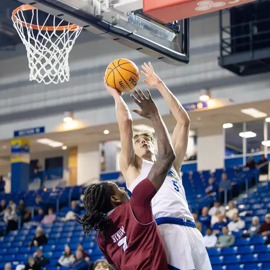 Three in Double Figures Leads Men’s Basketball Past Rider 65-57