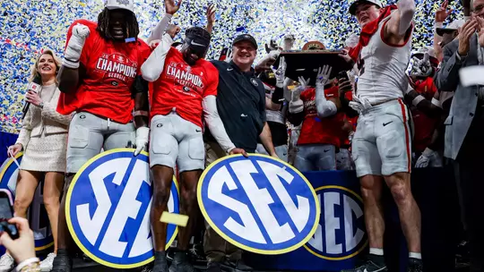 Georgia outside linebacker Quintavius Johnson (33), Georgia defensive back Ellis Robinson IV (1), Georgia head coach Kirby Smart after Georgia's game against Alabama in the 2025 SEC Championship at Mercedes-Benz Stadium in Atlanta, Ga., on Saturday, Dec. 6, 2025. (Conor Dillon/UGAAA)