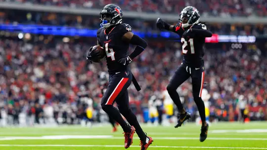HOUSTON, TEXAS - JANUARY 11: Cornerback Kamari Lassiter #4 of the Houston Texans celebrates after securing an interception during the first half of an AFC Wild Card game against the Los Angeles Chargers, at NRG Stadium on January 11, 2025 in Houston, Texas. (Photo by Brooke Sutton/Getty Images)