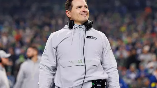 SEATTLE, WASHINGTON - DECEMBER 18: Head coach Mike MacDonald of the Seattle Seahawks stands on the sidelines during the national anthem prior to an NFL football game against the Los Angeles Rams at Lumen Field on December 18, 2025 in Seattle, Washington. (Photo by Brooke Sutton/Getty Images)