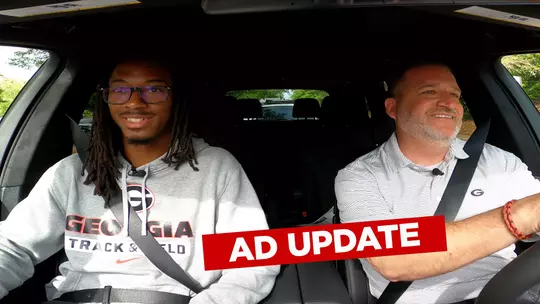AD Josh Brooks and Track and Field athlete Jonathan Simms riding in a car for the BMW AD Update.