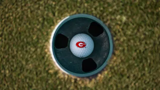 Shot of Georgia "G" golf ball in cup (photo by Conor Dillon).