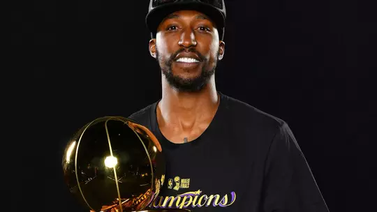 Kentavious Caldwell-Pope with the 2020 NBA trophy (photo courtesy NBAE/Getty Images).