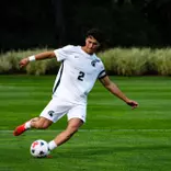 Will Eby strikes ball against Wisconsin