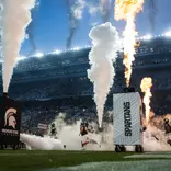 Michigan State runs out of the tunnel in the season opener vs. Toledo.