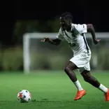 Leo Conneh strikes the ball against Michigan