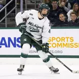 Brady Peddle handles the puck against Northern Michigan at Munn Ice Arena