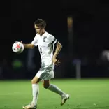 Miles Merritt handles the ball vs. Michigan