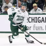 Cullen Potter handles the puck at Munn Ice Arena