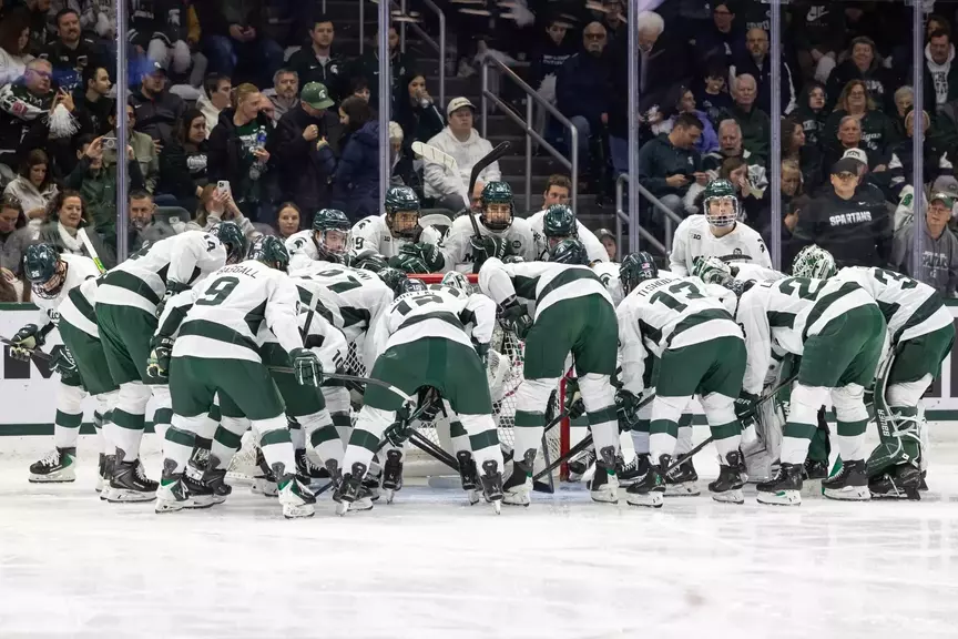 Michigan State hockey huddles before game against Ohio State