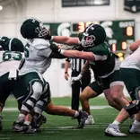 The Michigan State football team conducts a team drill during spring practice in March 2026.