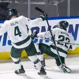 Porter Martone and Colin Ralph celebrate after a Martone goal in the NCAA Tournament against UConn
