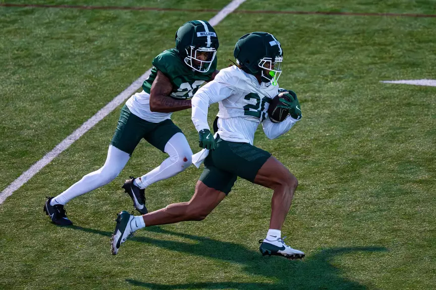 Michigan State's Keshawn Williams and Zion Gist go through a drill during spring practice in March 2026.