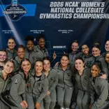 Gymnastics team in front of bracket after advancing at NCAA Tempe Regional