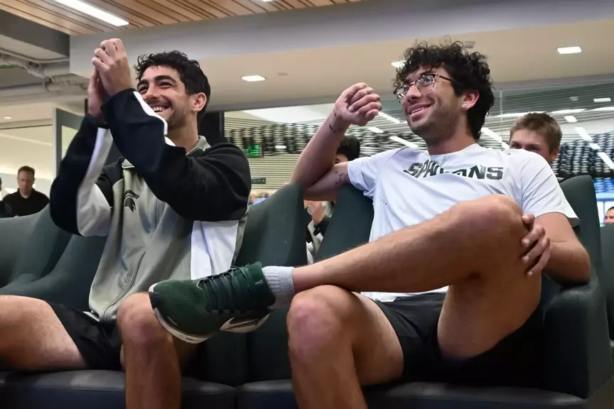 Taym Alazmeh and Ozan Baris celebrate the announcement of Michigan State men's tennis in the NCAA Tournament at the Selection Show watch party in Jenison Field House.