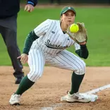 Hannah Hawley catches the ball at third base to apply the tag on a stealing runner against Illinois