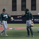 Aidan Donovan and Adam Broski fist bump after inning