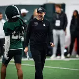 Joe Rossi walks the field during spring practice at Michigan State in March 2026.