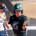 Hannah Greer celebrates after a base hit