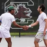 Matthew Forbes and Ozan Baris high five during their doubles match vs North Carolina in the first round of the NCAA Tournament in Columbia, South Carolina, hosted by South Carolina.