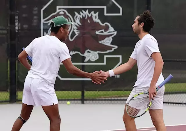Matthew Forbes and Ozan Baris high five during their doubles match vs North Carolina in the first round of the NCAA Tournament in Columbia, South Carolina, hosted by South Carolina.