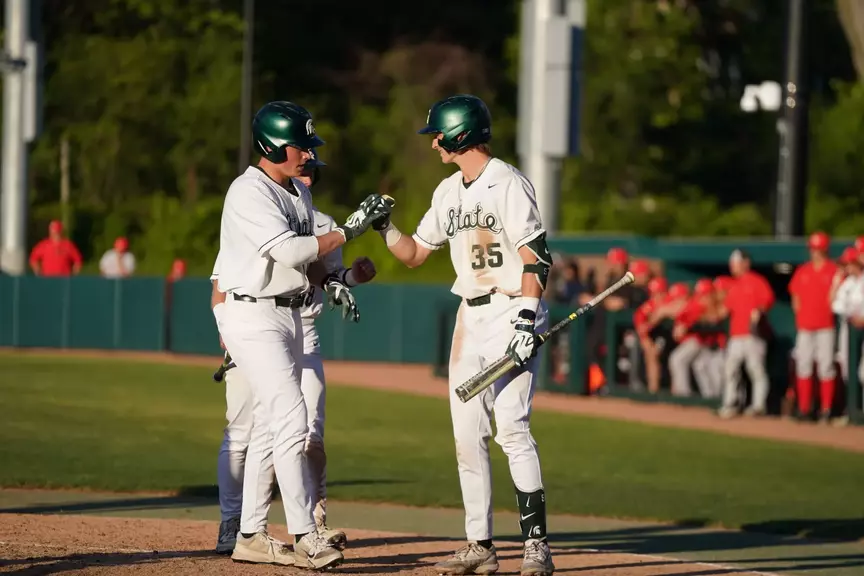Parker Picot and Randy Seymour celebrate at home plate during game vs. Illinois State on May 14, 2026