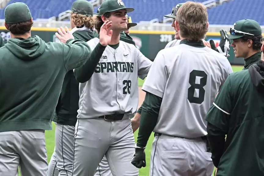 Aidan Donovan is congratulated by teammates during the Big Ten Tournament game vs. Purdue at Charles Schwab Field Omaha in Omaha, Nebraska on May 19, 2026