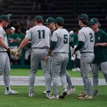Andrew Siler is greeted by teammates returning to the dugout between innings during game at Eastern Michigan on March 10, 2026.
