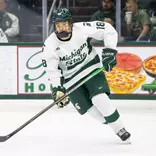 Ryker Lee on the ice skating against Wisconsin at Munn Ice Arena