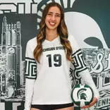 Hayley Ogden stands with a volleyball