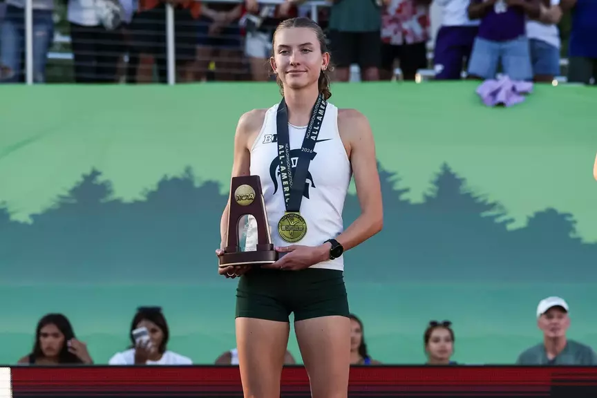 Kate Stewart-Barnett at the podium at the NCAA Championships