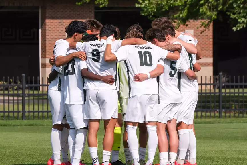 2026 team huddles before game